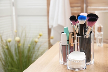 Organized makeup brushes on a modern bathroom counter