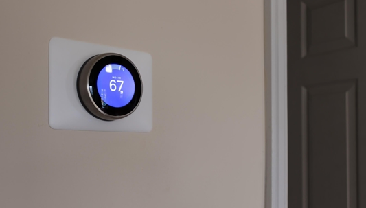 Photo of a new programmable thermostat in a home