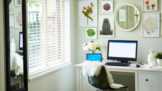 Organized modern home office with desktop monitor on