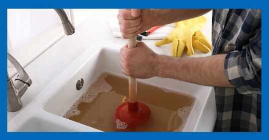 unclogging drain with plunger
