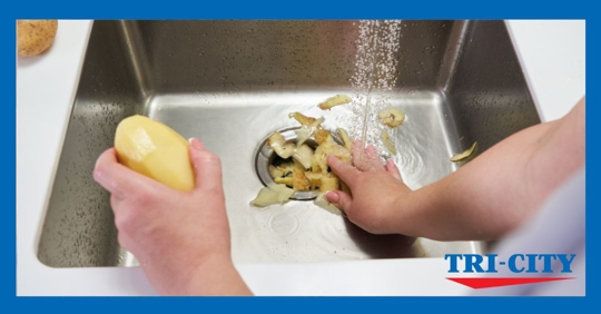 peeling potatoes in garbage disposal
