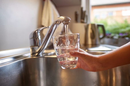 filling up glass of water from tap