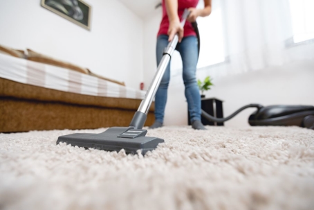 vacuuming carpet