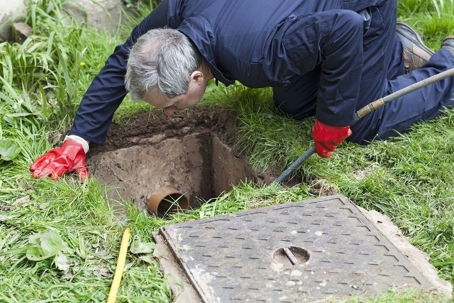 plumber inspecting underground sewer lines