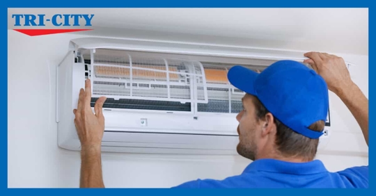 Man Looking at HVAC Unit