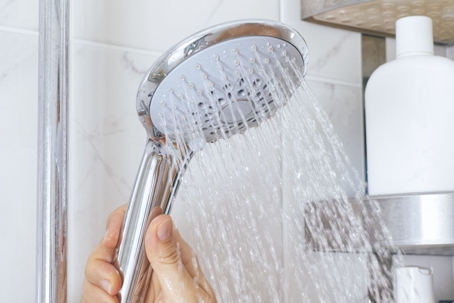 woman-holding-shower-head