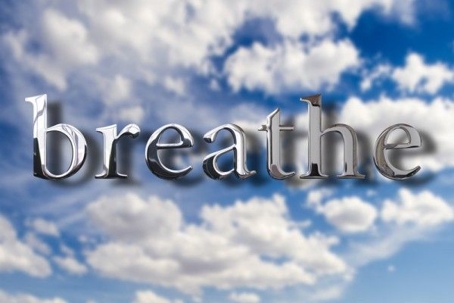 cloudy sky with the word "breathe"