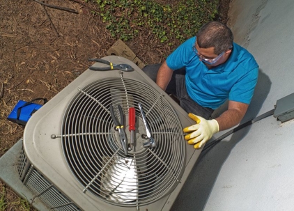 technician repairing an air conditioner