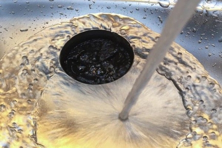 A sink with running water